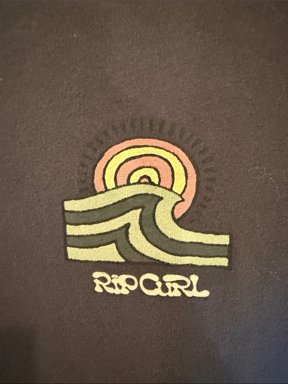 Rip Curl t-shirt in small - color is a brownish black. Like new!